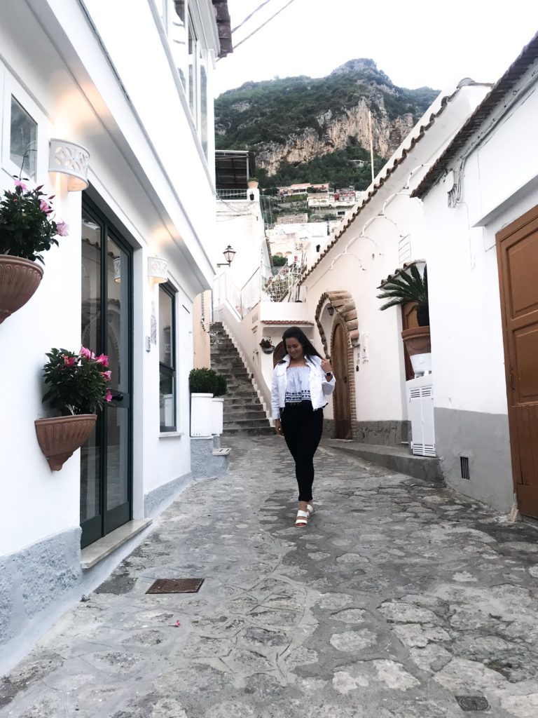 Travel blogger traveling alone in Positano, Amalfi Coast, Italy.